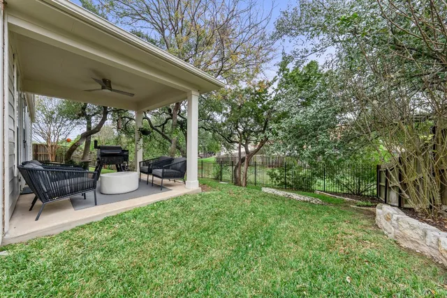 a view of a porch with furniture and a fire pit
