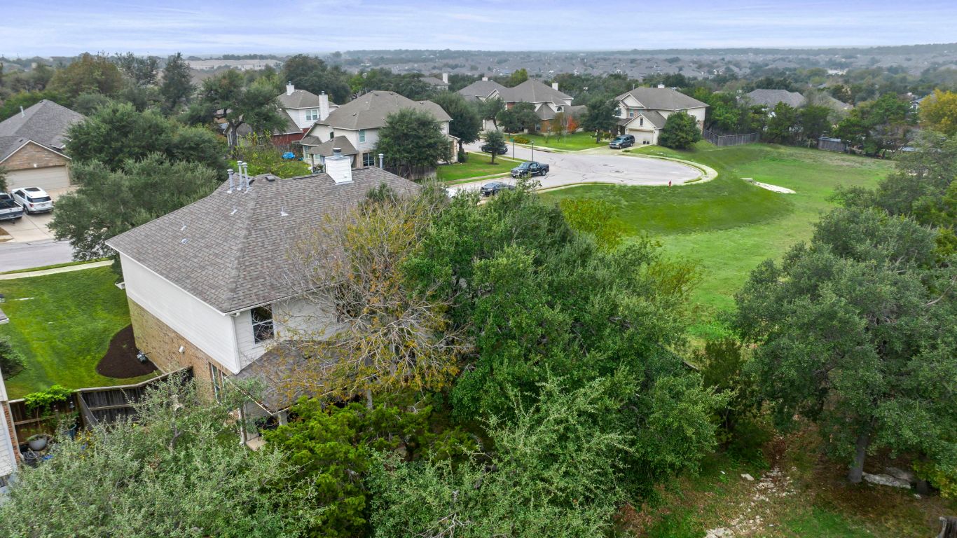 1912 Wildfire Leander, TX 78641 - Photo 38 of 40 an aerial view of residential houses with outdoor space and trees