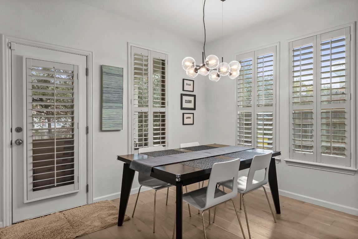 1912 Wildfire Leander, TX 78641 - Photo 9 of 40 a view of a dining room with furniture window and wooden floor
