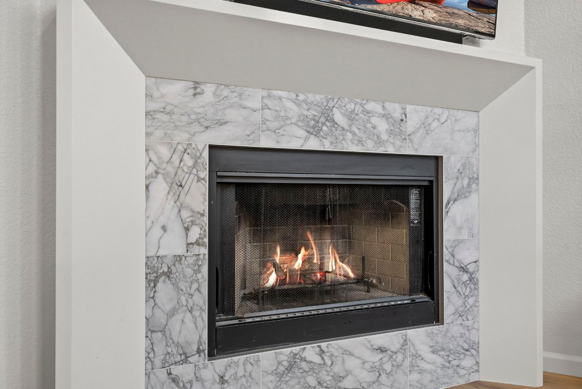 1912 Wildfire Leander, TX 78641 - Photo 10 of 40 a fireplace with a clock on it