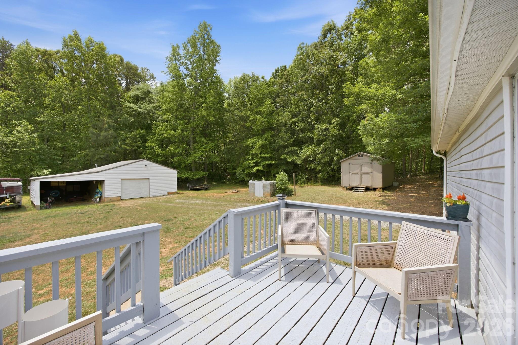 675 Overcash Road Salisbury, NC 28147 - Photo 31 of 48 a view of a deck with chairs wooden floor and fence