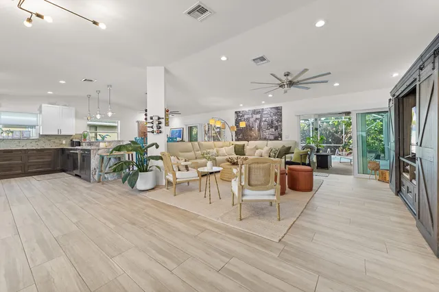 a large kitchen with a table and chairs