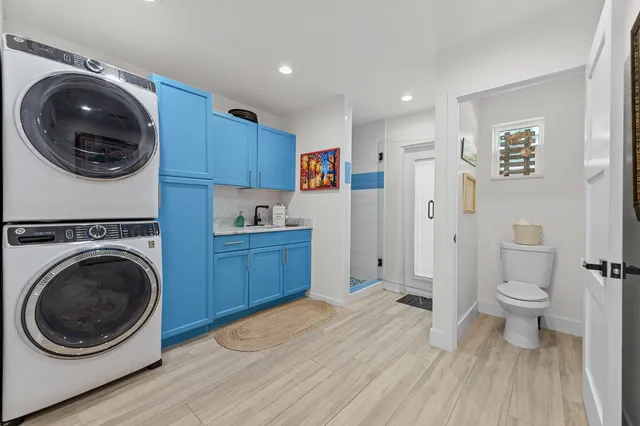 a view of a kitchen with a washer and dryer