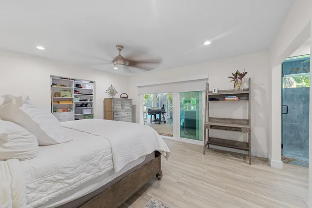 a bed room with a bed and a walk in closet