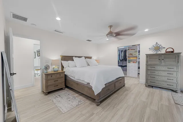 a bed room with a bed and dresser