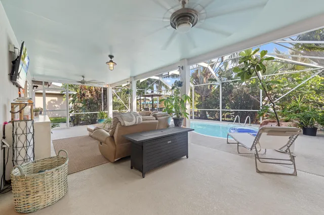 a view of living room with furniture and a large window