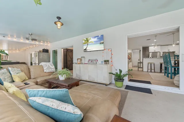 a living room with furniture and a table