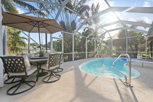 a view of a chairs and table in the patio