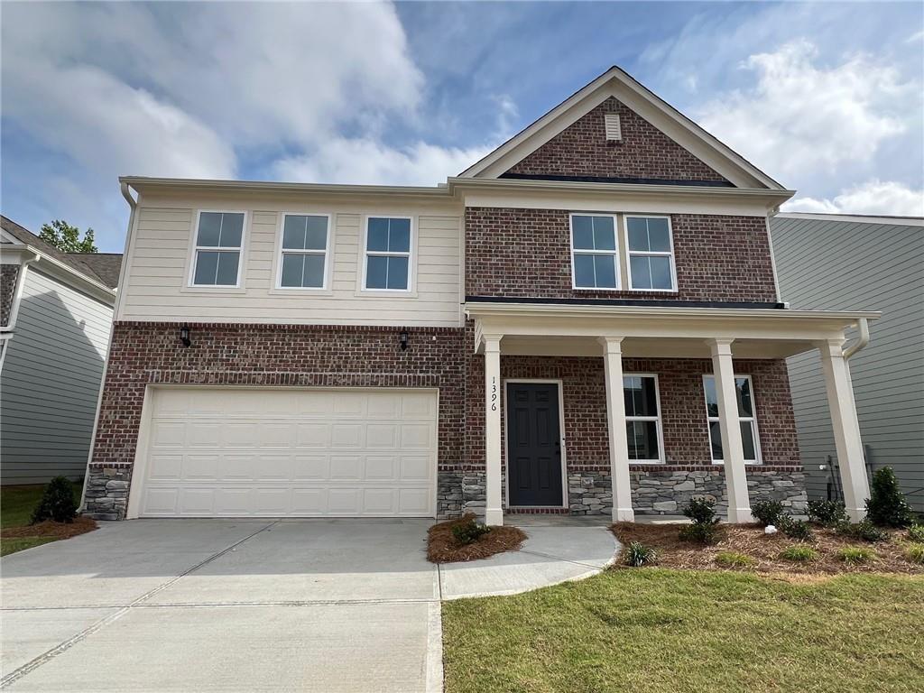 1396 Maston Road Auburn, GA 30011 - Photo 1 of 1 a front view of a house with a yard