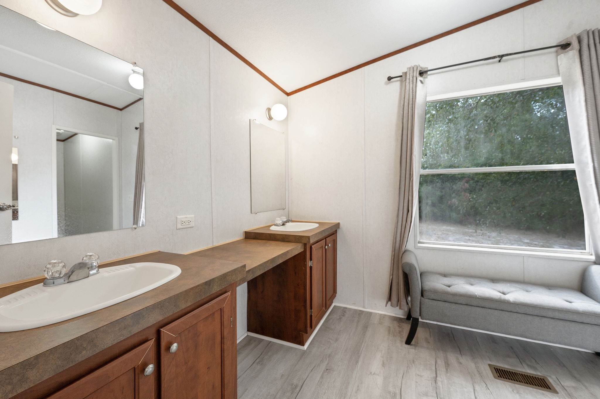 6493 Pappas Road Waller, TX 77484 - Photo 16 of 32 Primary bathroom featuring a dual vanity and extra storage, optimized for convenience and modern utility.