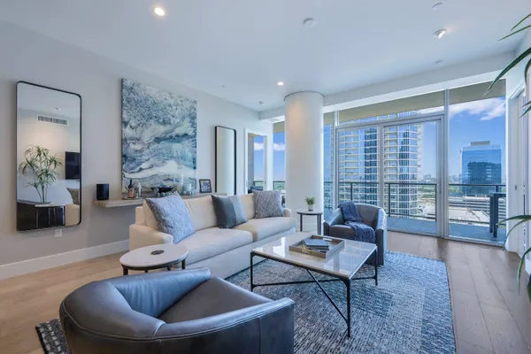 a living room with furniture and a large window