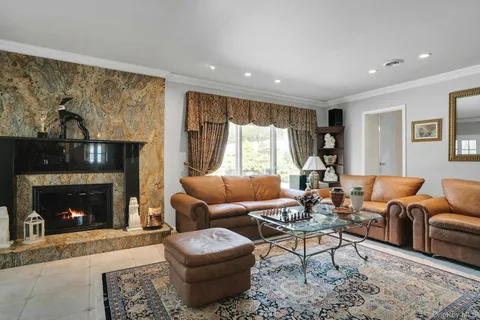 a living room with furniture and a rug