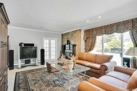 a kitchen with granite countertop white cabinets and appliances