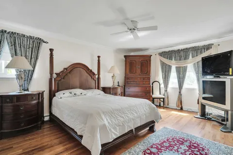 a bedroom with a bed and a dresser