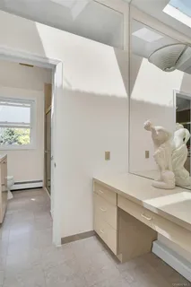 a bathroom with a sink and a window