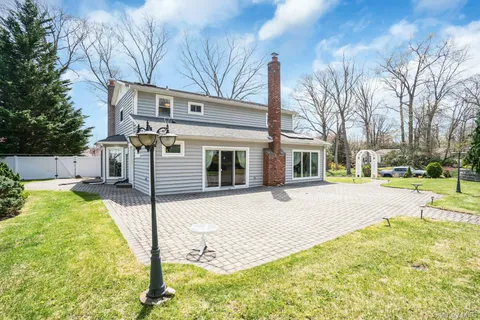 a view of park with large trees