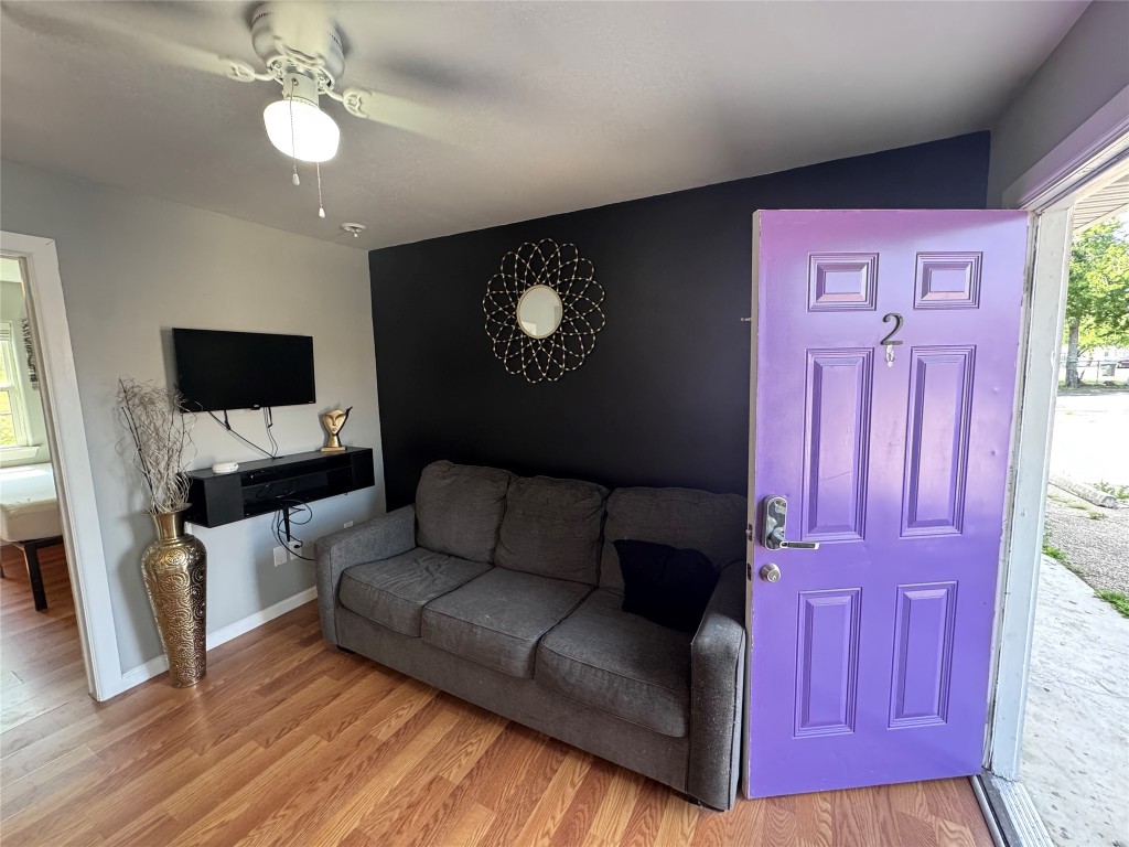 1402 North 2nd Street, Unit 4 Killeen, TX 76541 - Photo 3 of 13 a living room with furniture and a flat screen tv