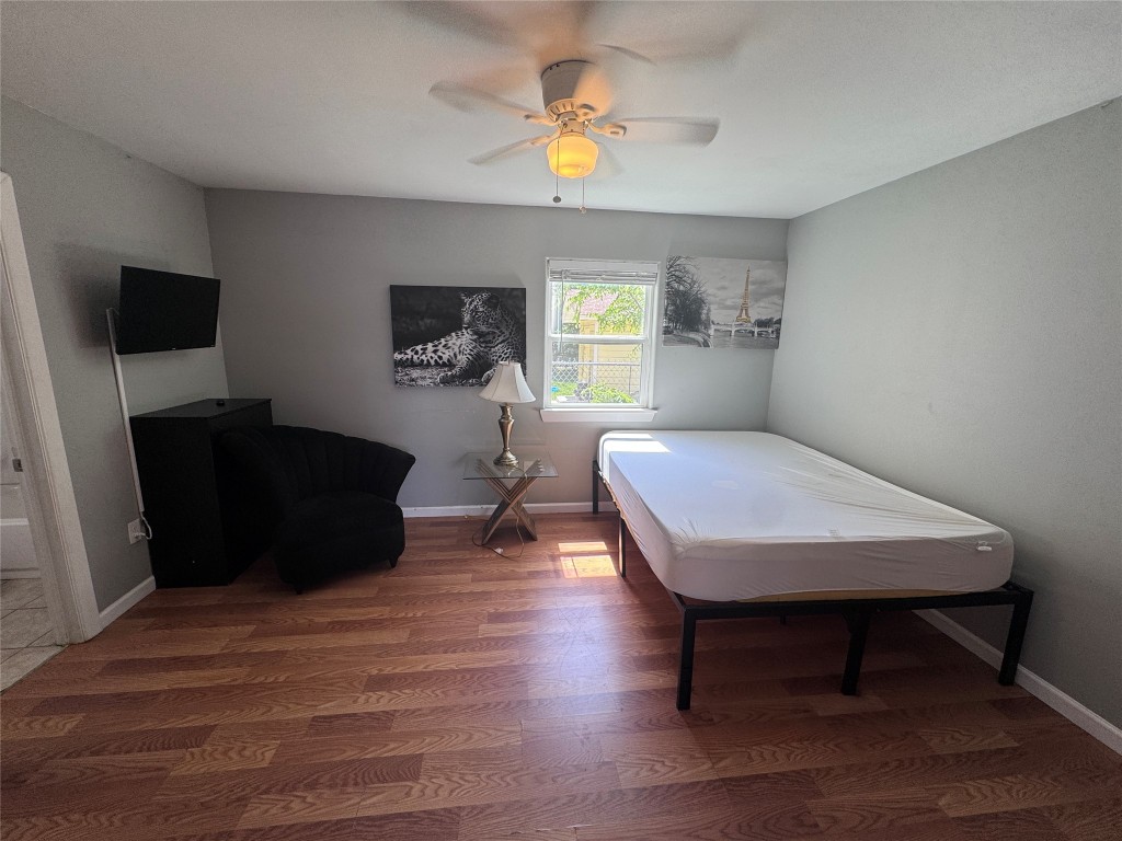 1402 North 2nd Street, Unit 4 Killeen, TX 76541 - Photo 5 of 13 a living room with furniture and a flat screen tv