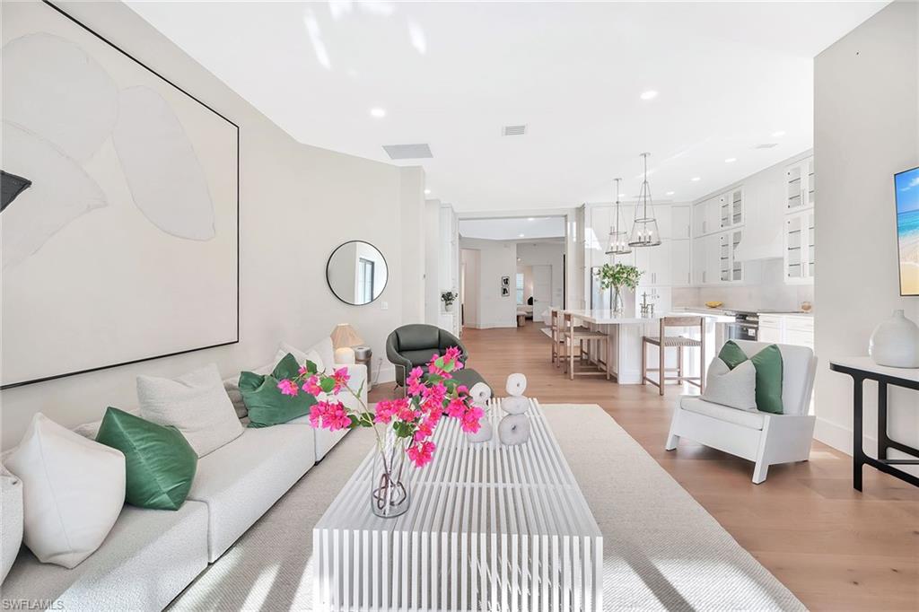 981 Tierra Lago Way Naples, FL 34119 - Photo 22 of 49 a living room with furniture and a table