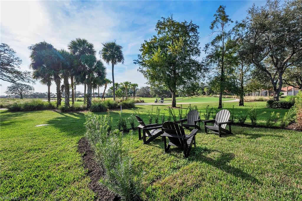 981 Tierra Lago Way Naples, FL 34119 - Photo 41 of 49 a view of a park with large trees