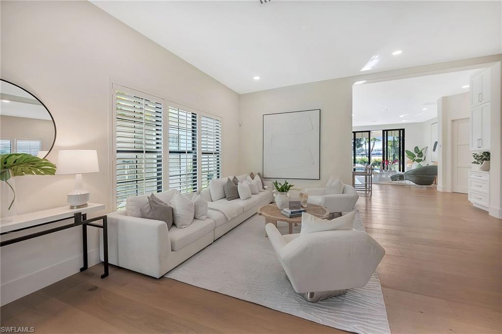 981 Tierra Lago Way Naples, FL 34119 - Photo 5 of 49 a living room with furniture and a large window