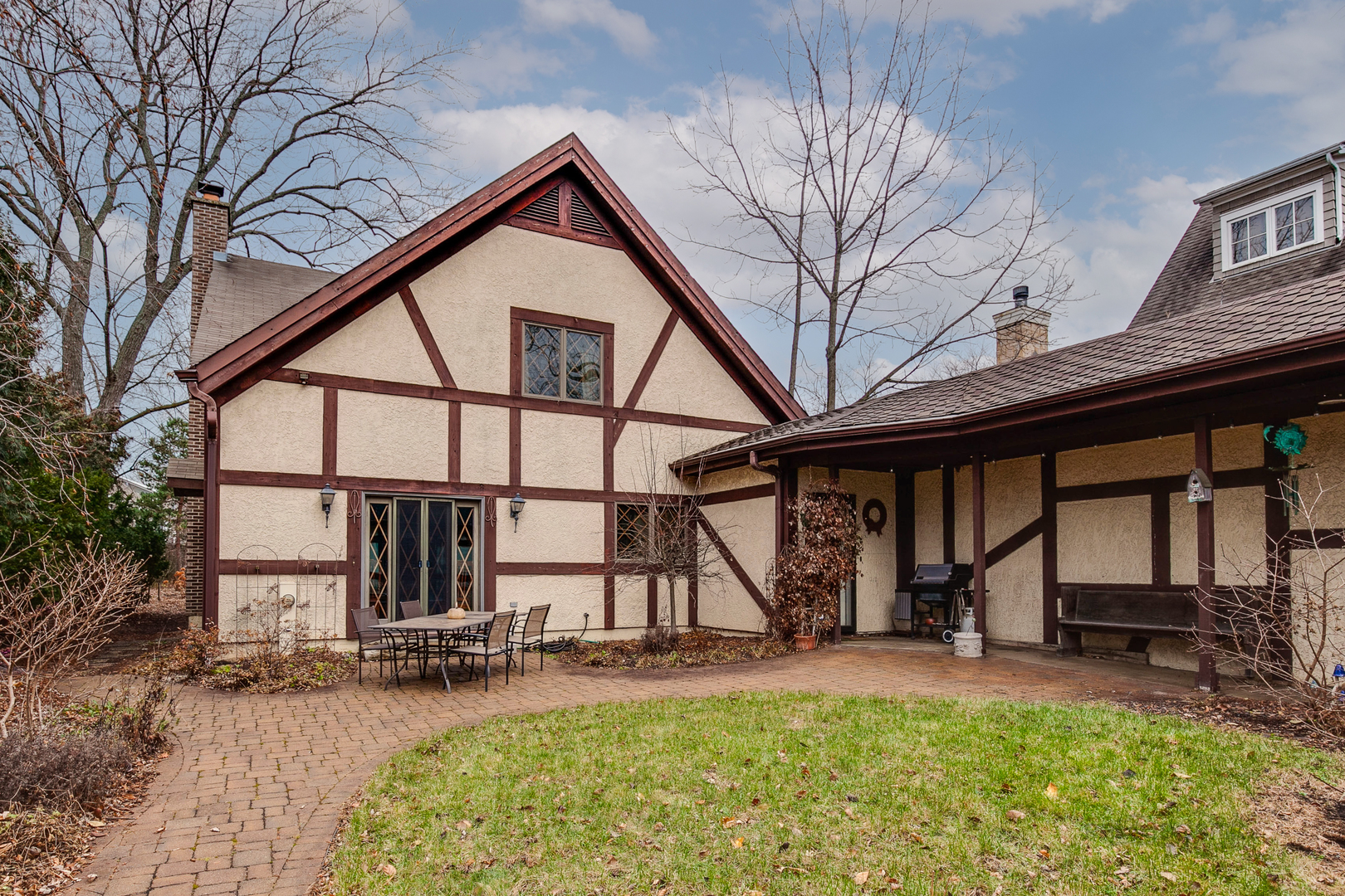889 Willow Road Winnetka, IL 60093 - Photo 1 of 28 a view of house with yard porch and furniture