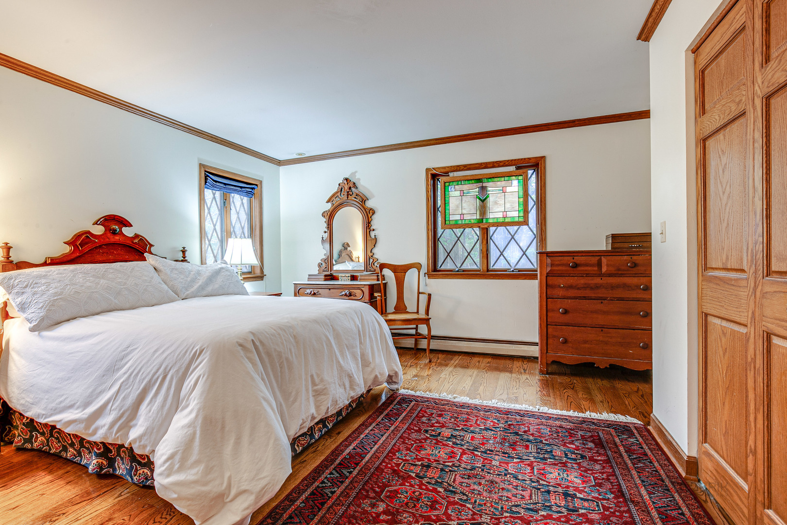 889 Willow Road Winnetka, IL 60093 - Photo 11 of 28 a bedroom with a bed and a window