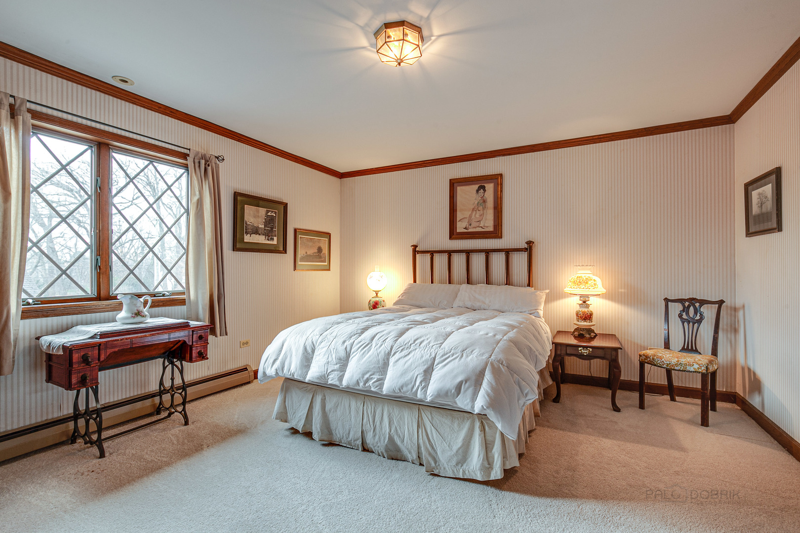 889 Willow Road Winnetka, IL 60093 - Photo 17 of 28 a bedroom with a bed and a window