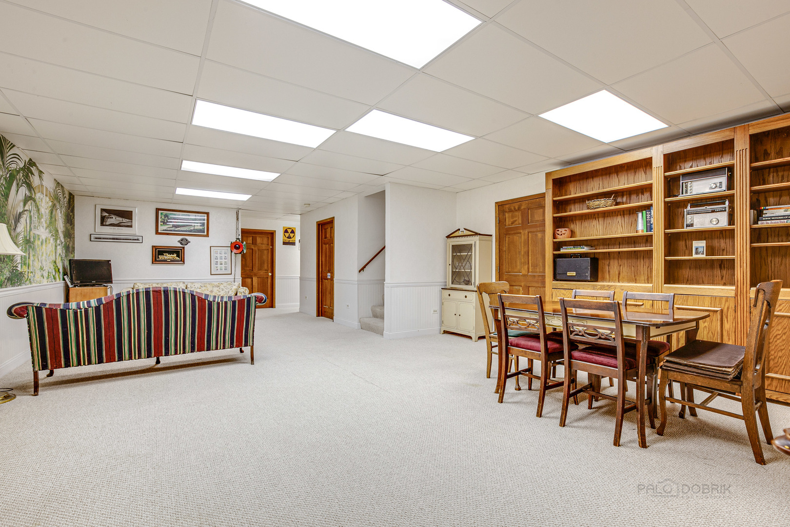 889 Willow Road Winnetka, IL 60093 - Photo 22 of 28 a view of a livingroom with furniture and staircase