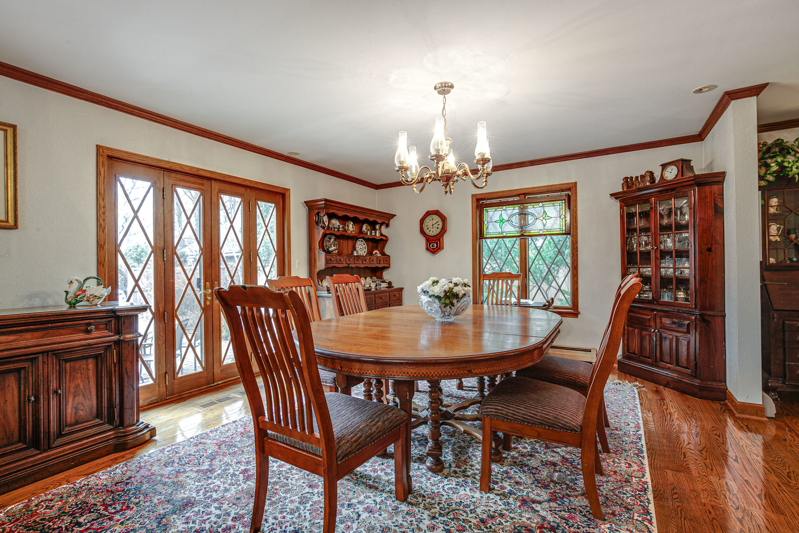 889 Willow Road Winnetka, IL 60093 - Photo 5 of 28 a view of a dining room with furniture window and wooden floor