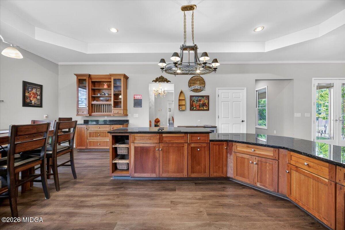 2415 Elko Road Elko, GA 31025 - Photo 12 of 57 a large kitchen with stainless steel appliances a stove center island a window and stools