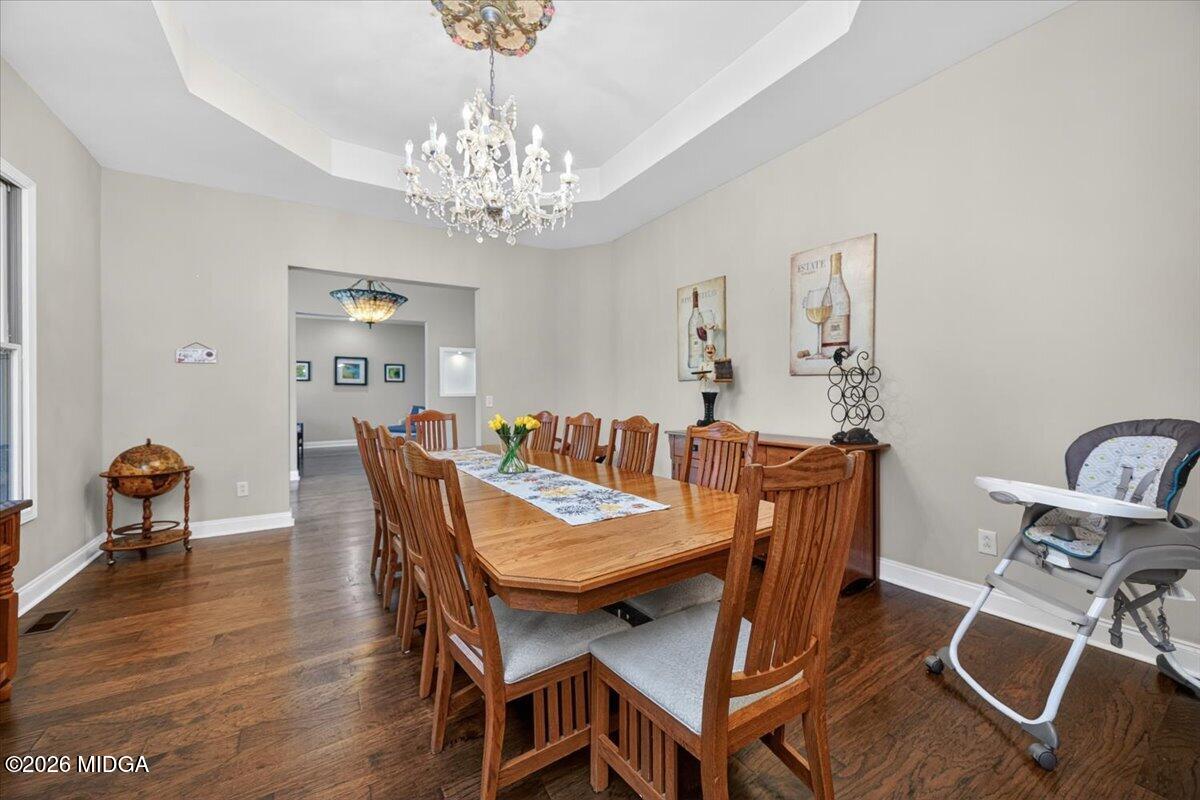 2415 Elko Road Elko, GA 31025 - Photo 17 of 57 a view of a dining room with furniture and wooden floor