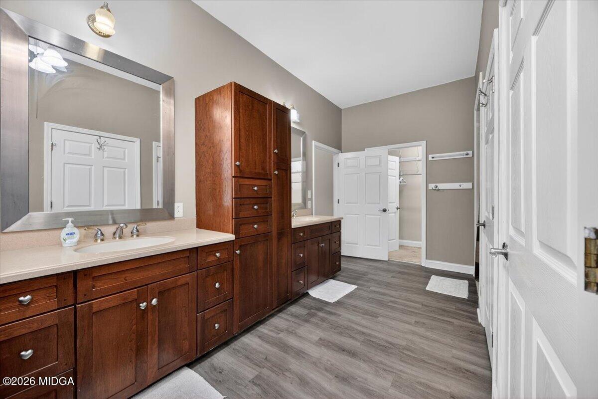 2415 Elko Road Elko, GA 31025 - Photo 26 of 57 a spacious bathroom with a double vanity sink a mirror and a shower