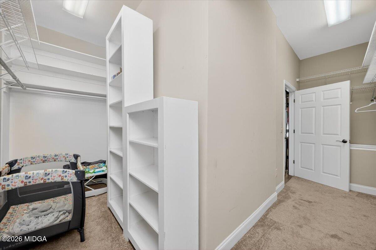2415 Elko Road Elko, GA 31025 - Photo 28 of 57 a view of walk in closet with clothes and shoes