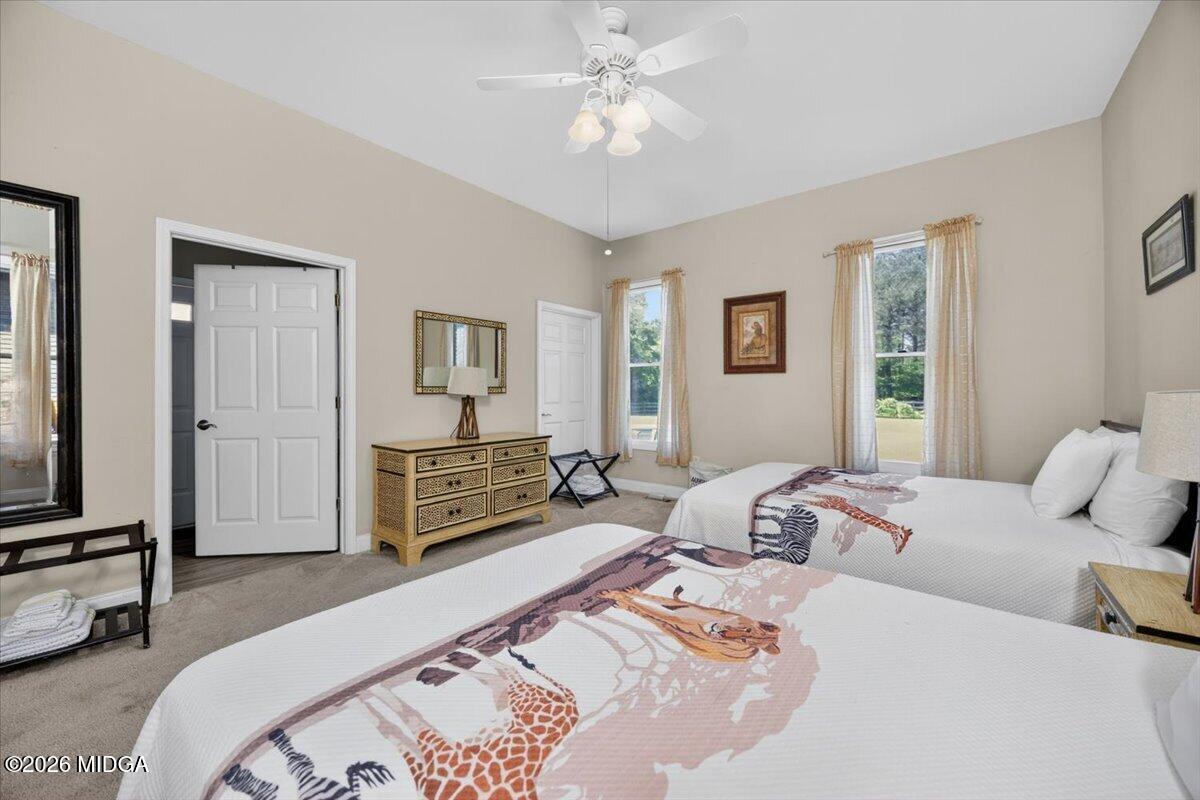 2415 Elko Road Elko, GA 31025 - Photo 41 of 57 a bedroom with a bed and a chandelier