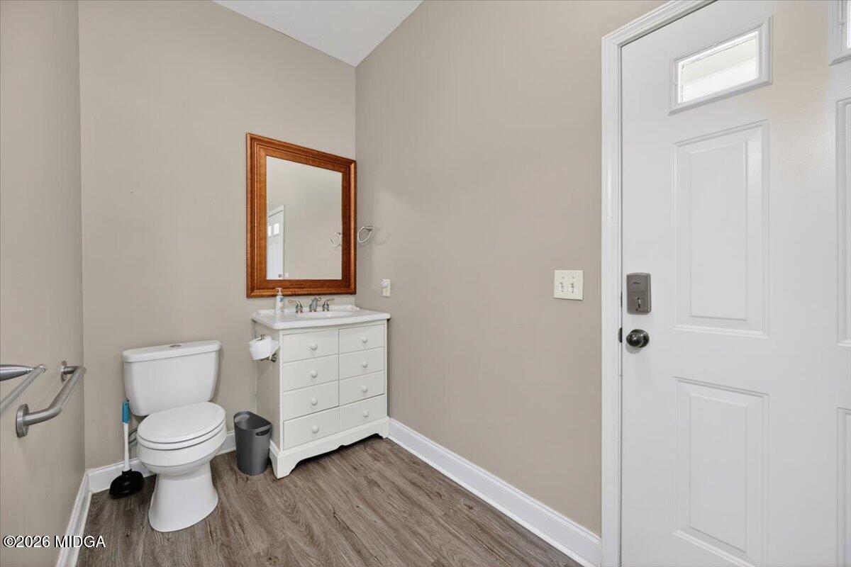 2415 Elko Road Elko, GA 31025 - Photo 42 of 57 a white toilet sitting next to a bathroom sink