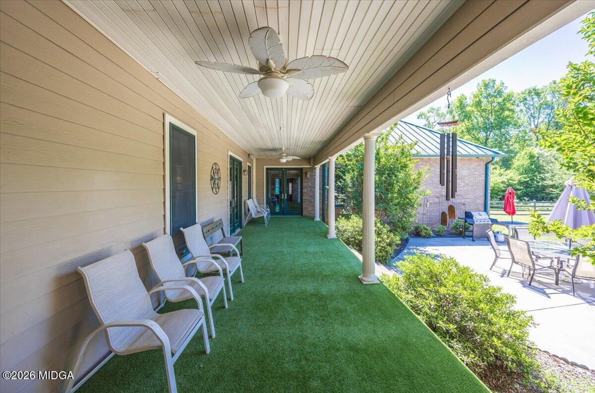 2415 Elko Road Elko, GA 31025 - Photo 44 of 57 a view of a patio with a table chairs and a backyard