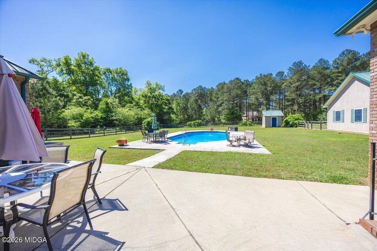 2415 Elko Road Elko, GA 31025 - Photo 46 of 57 a view of a swimming pool and lounge chairs
