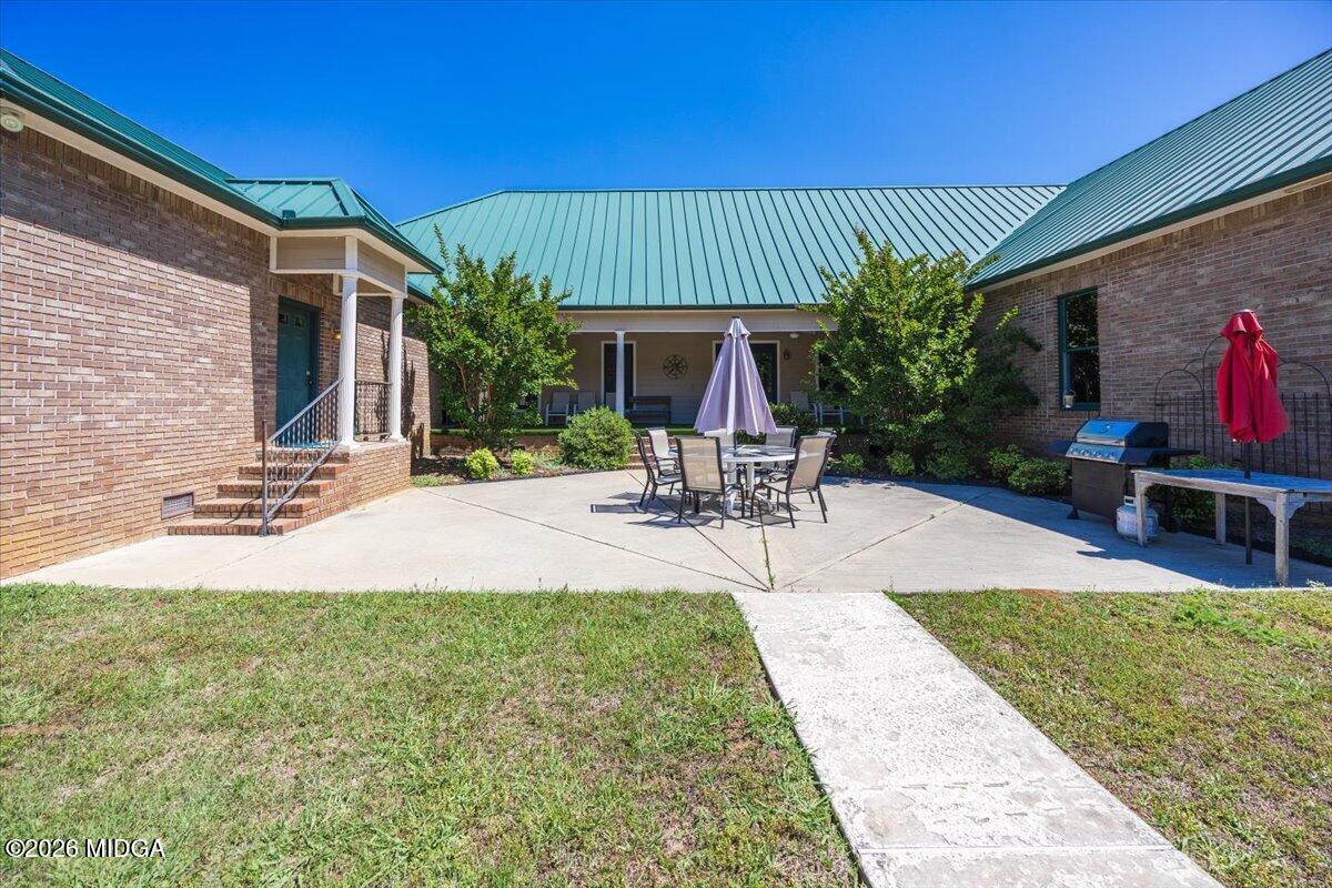2415 Elko Road Elko, GA 31025 - Photo 47 of 57 a view of a backyard with a patio