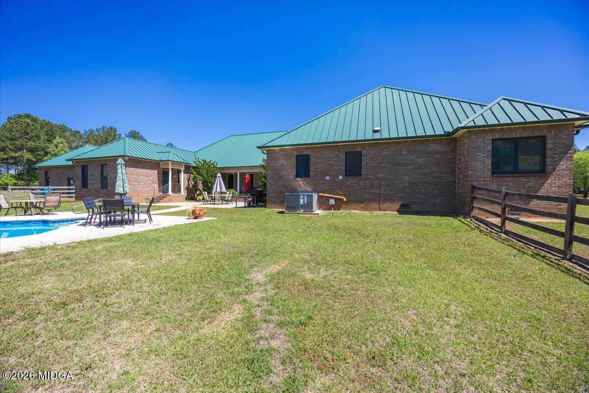 2415 Elko Road Elko, GA 31025 - Photo 51 of 57 a front view of a house with garden