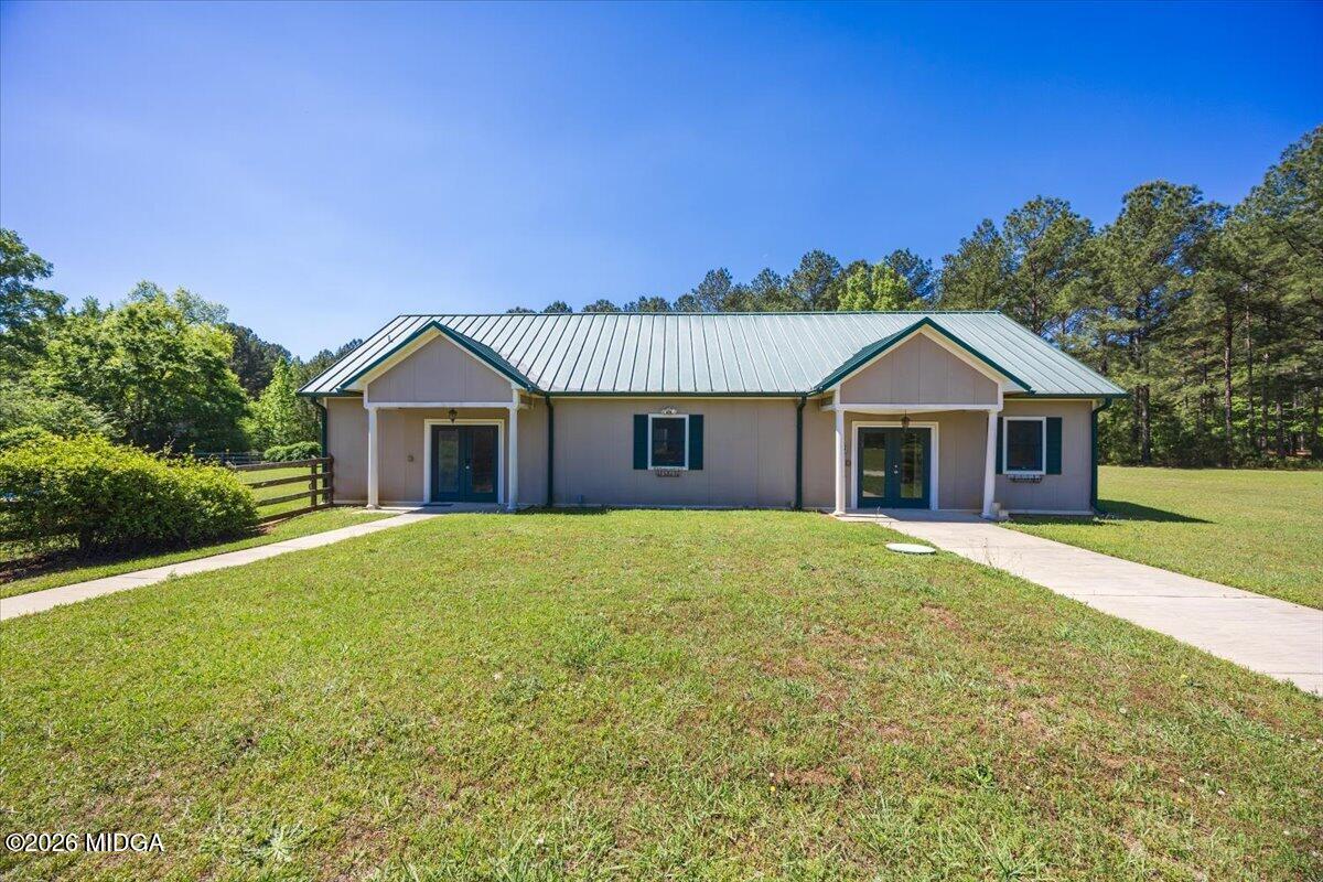 2415 Elko Road Elko, GA 31025 - Photo 52 of 57 a front view of a house with garden