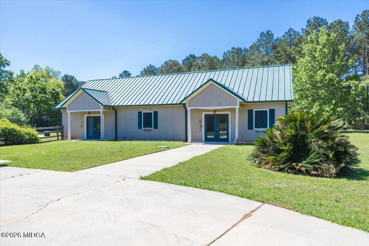 2415 Elko Road Elko, GA 31025 - Photo 53 of 57 a front view of a house with a garden