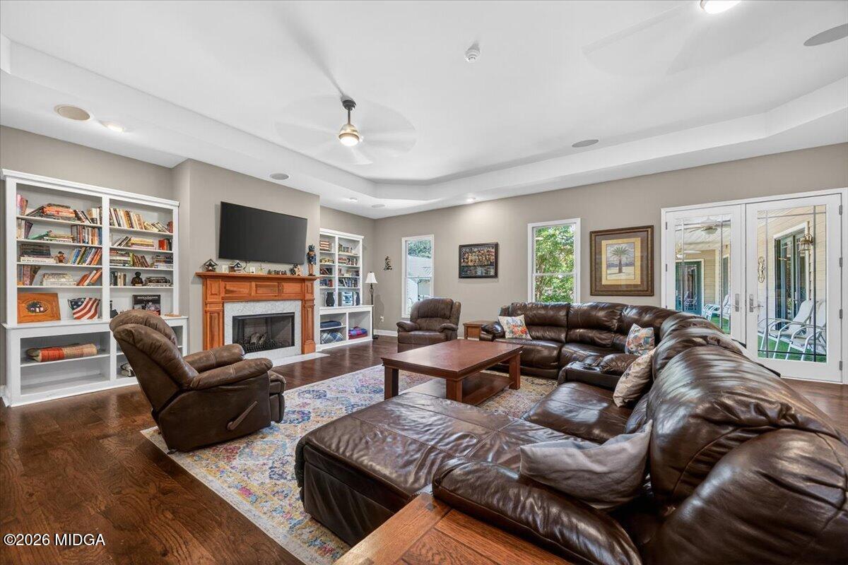 2415 Elko Road Elko, GA 31025 - Photo 6 of 57 a living room with furniture a fireplace and a flat screen tv