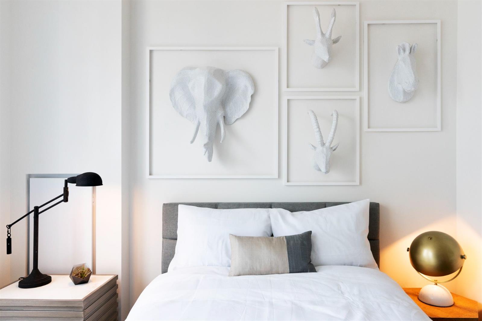 19 Dutch Street, Unit 50H Manhattan, NY 10038 - Photo 18 of 36 a bedroom with a bed and walk in closet