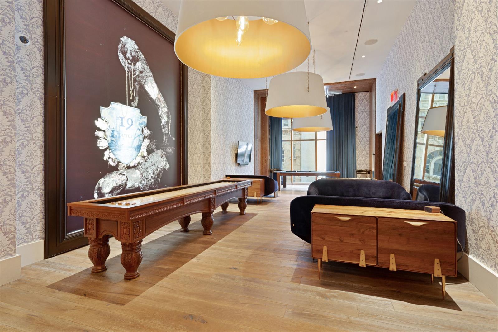 19 Dutch Street, Unit 50H Manhattan, NY 10038 - Photo 28 of 36 a room with pool table and windows