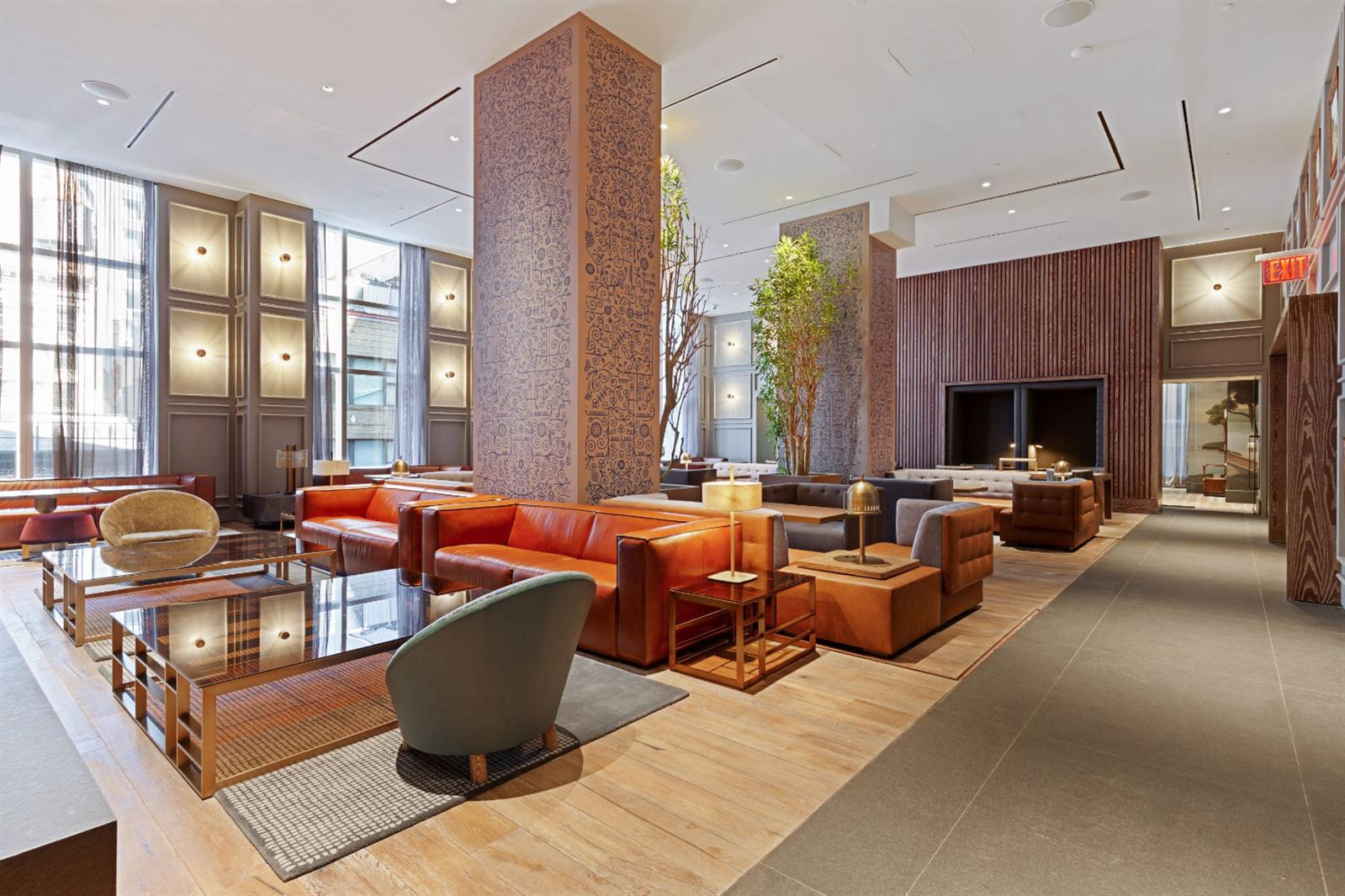 19 Dutch Street, Unit 50H Manhattan, NY 10038 - Photo 29 of 36 a living room with fireplace furniture and a large window