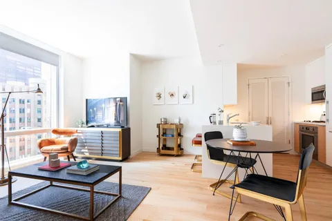 a living room with furniture and a table