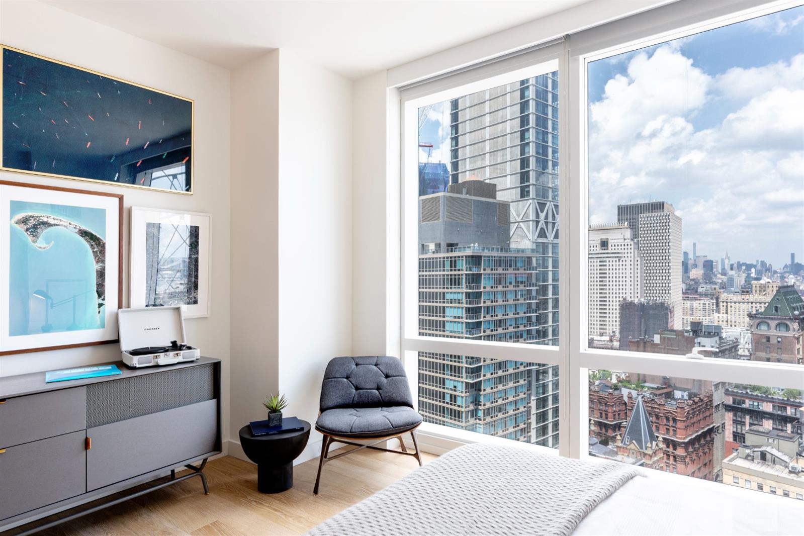 19 Dutch Street, Unit 50H Manhattan, NY 10038 - Photo 10 of 36 a living room with furniture