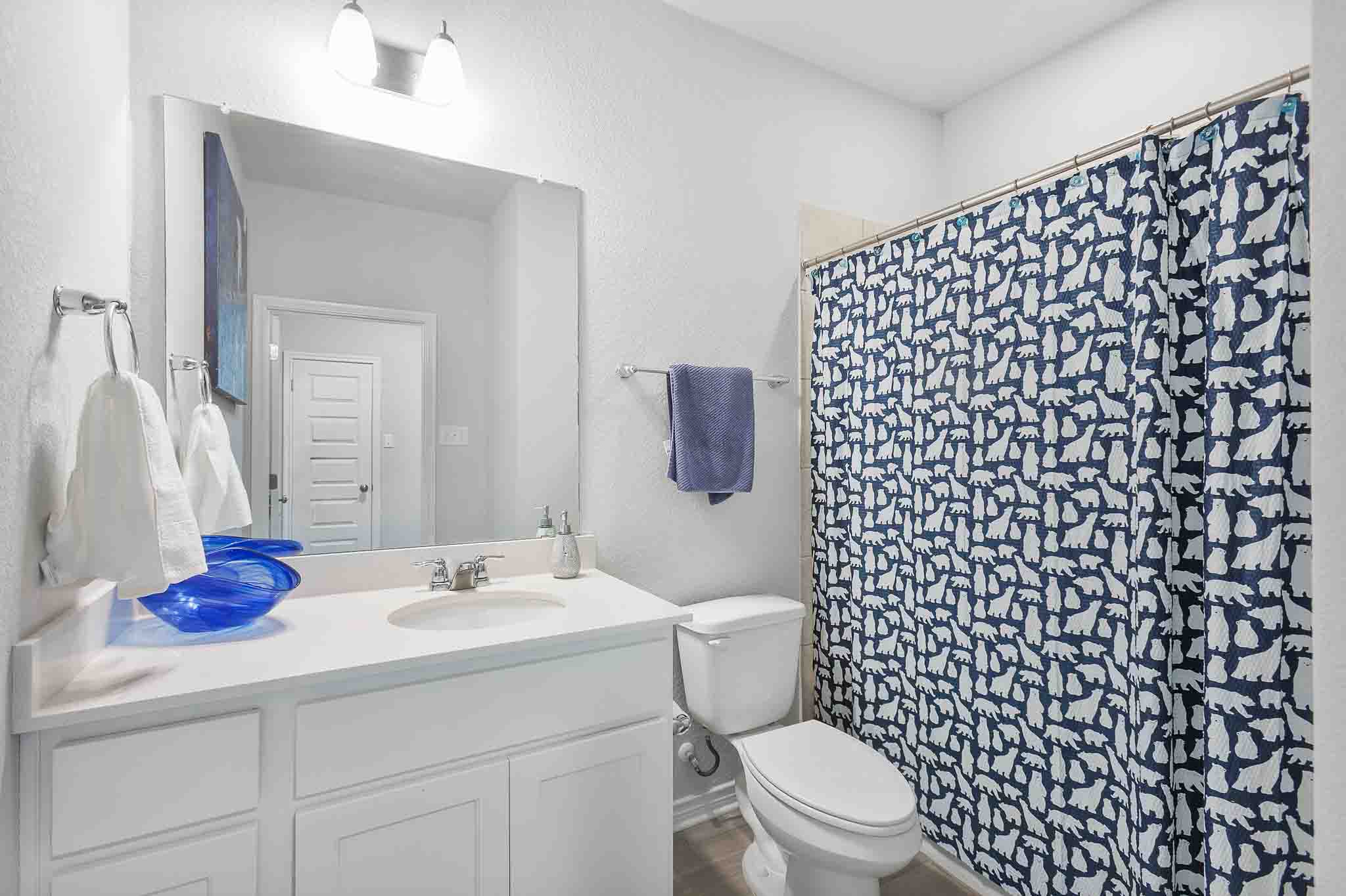 616 Barbary Coast Lane Jarrell, TX 76537 - Photo 15 of 37 a bathroom with a sink toilet and shower