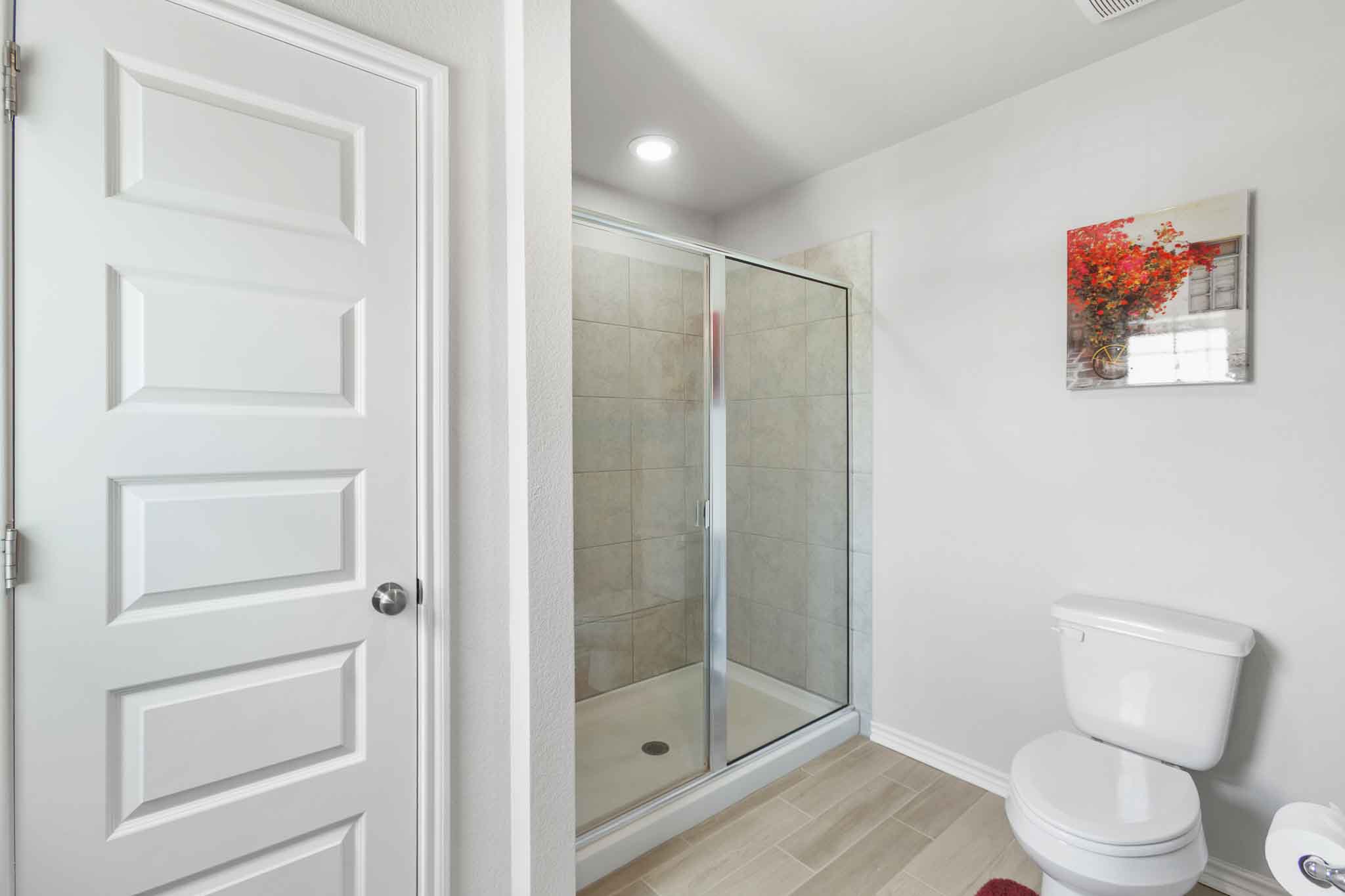 616 Barbary Coast Lane Jarrell, TX 76537 - Photo 23 of 37 a bathroom with a toilet and a shower